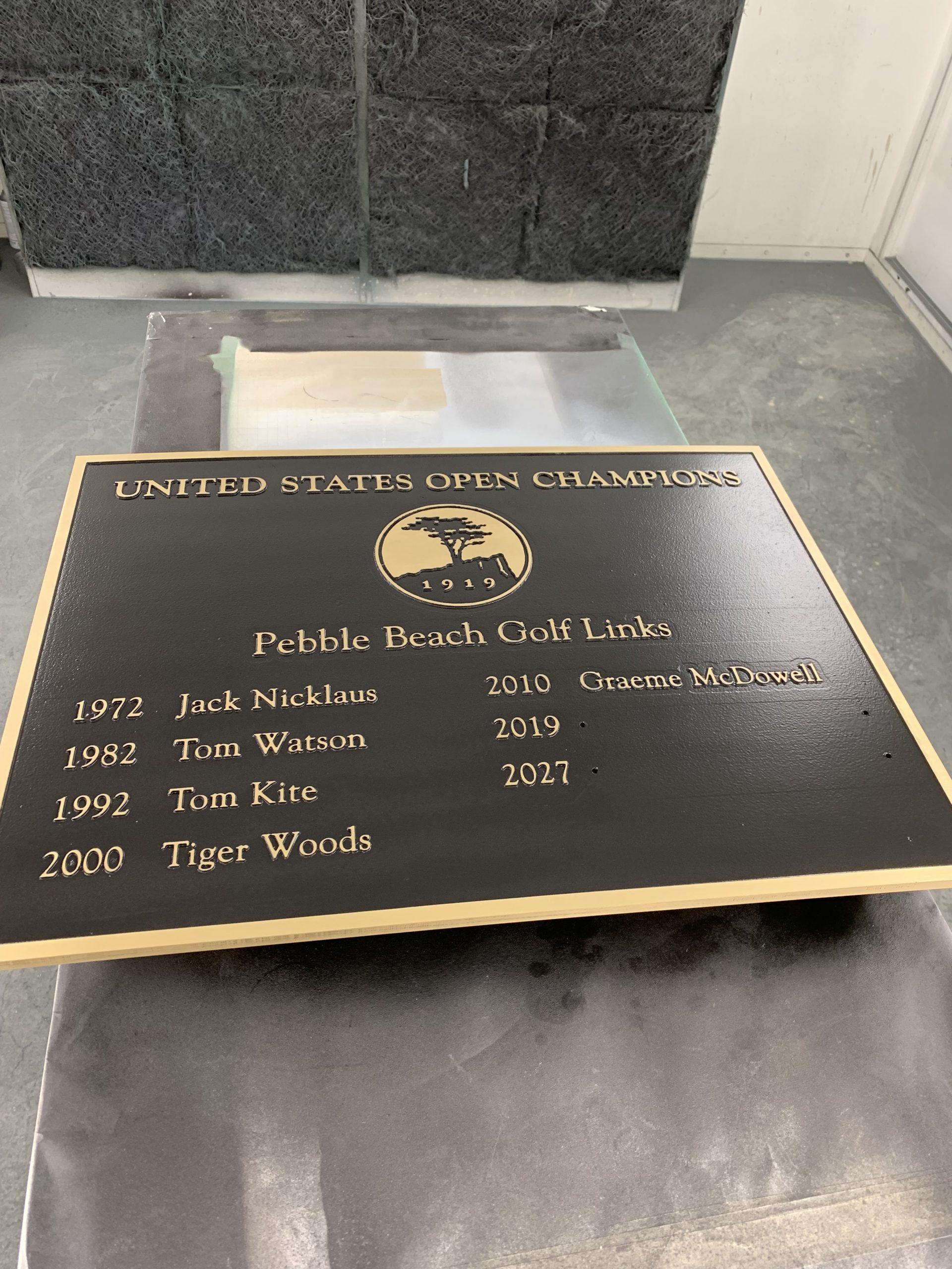 Finished US Open Champions brass plaque for Pebble Beach Golf Links -- CNC-machined marine brass with oxidized background and polished raised text