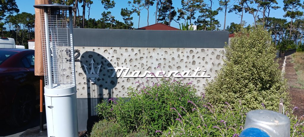 Maserati branded entrance sign and custom structure at Monterey Car Week event produced by Signworks