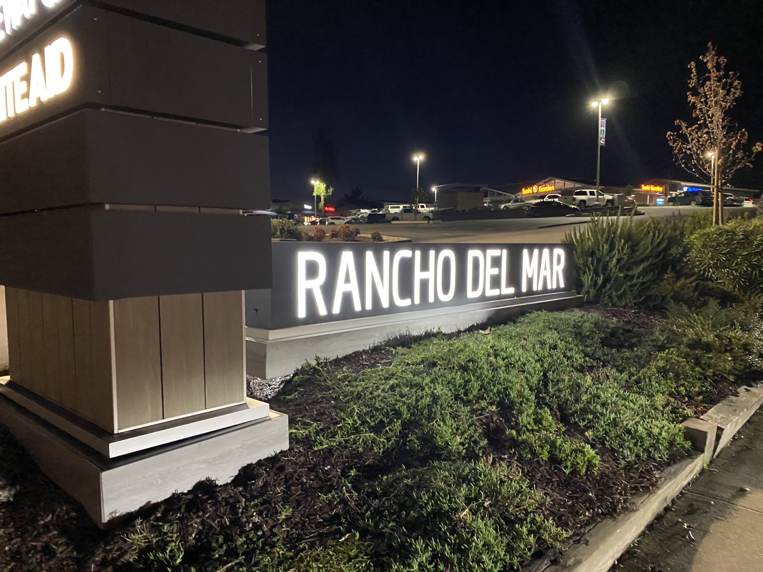 Rancho Del Mar illuminated channel letters glowing at night