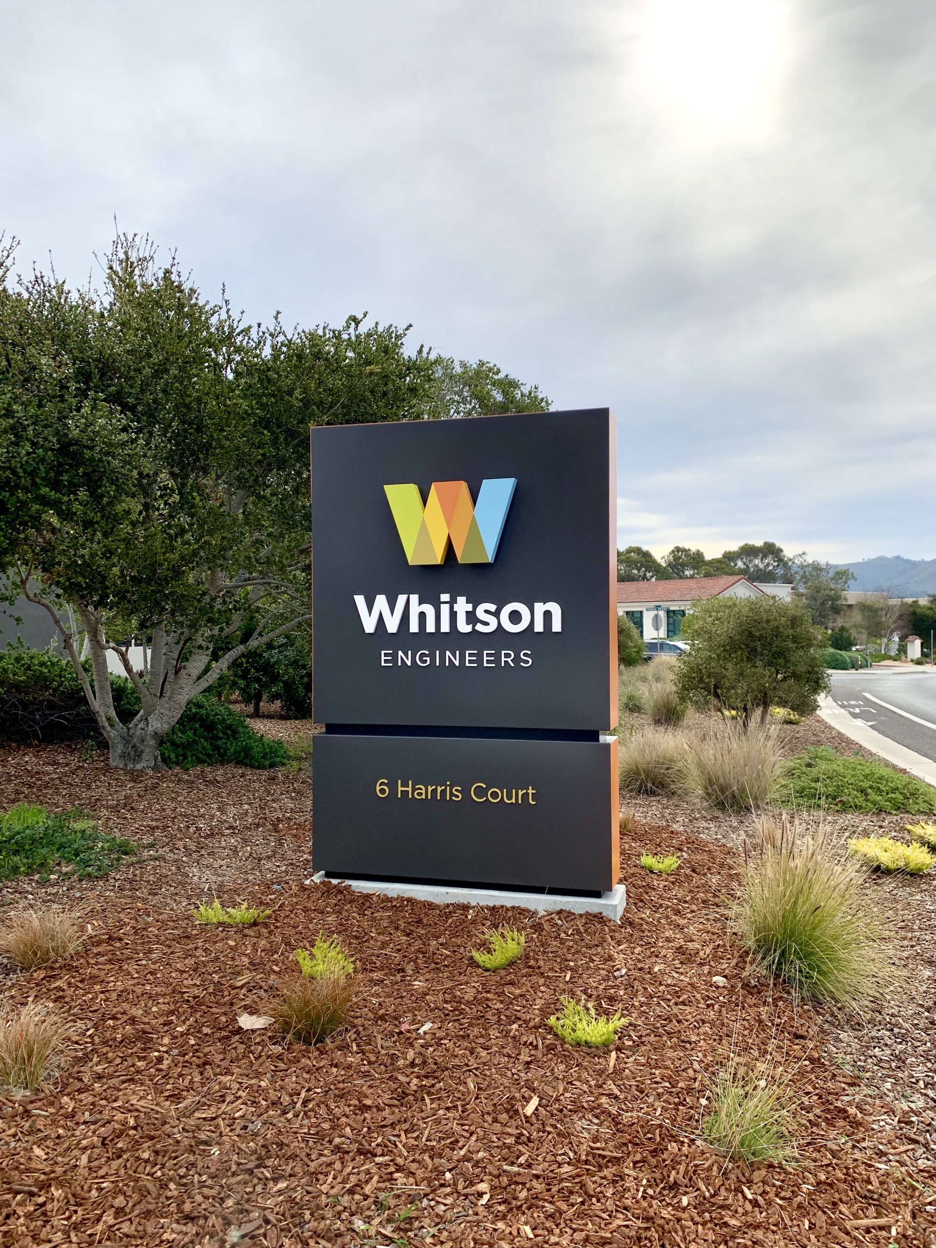 Whitson Engineers monument sign with colorful W logo installed by Signworks in Monterey County