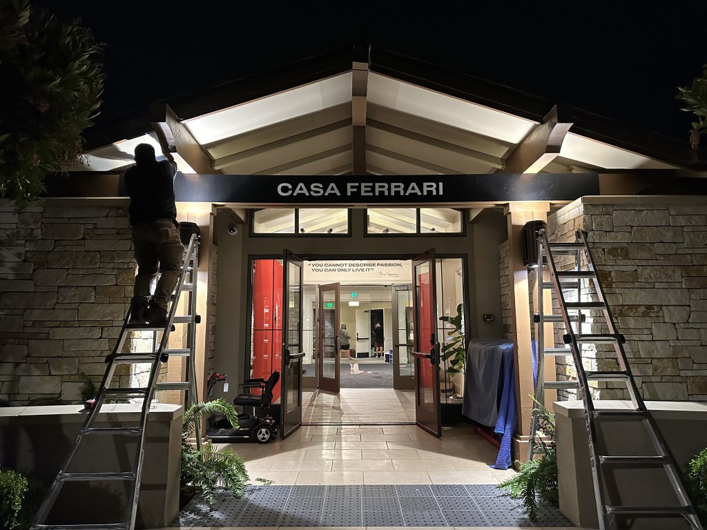 Casa Ferrari entrance signage installation during Monterey Car Week produced by Signworks