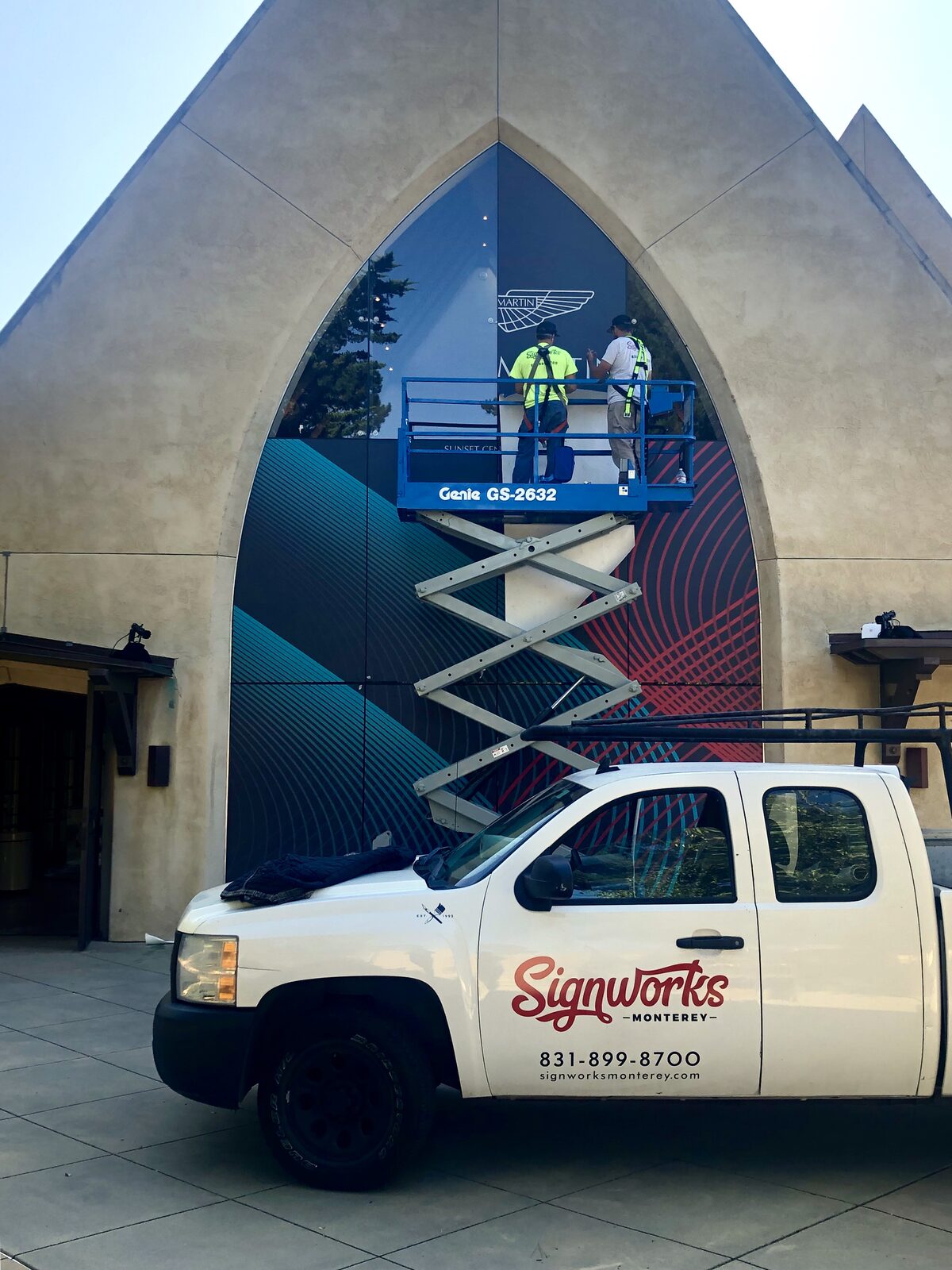 Aston Martin wall wrap event signage installation by Signworks Monterey