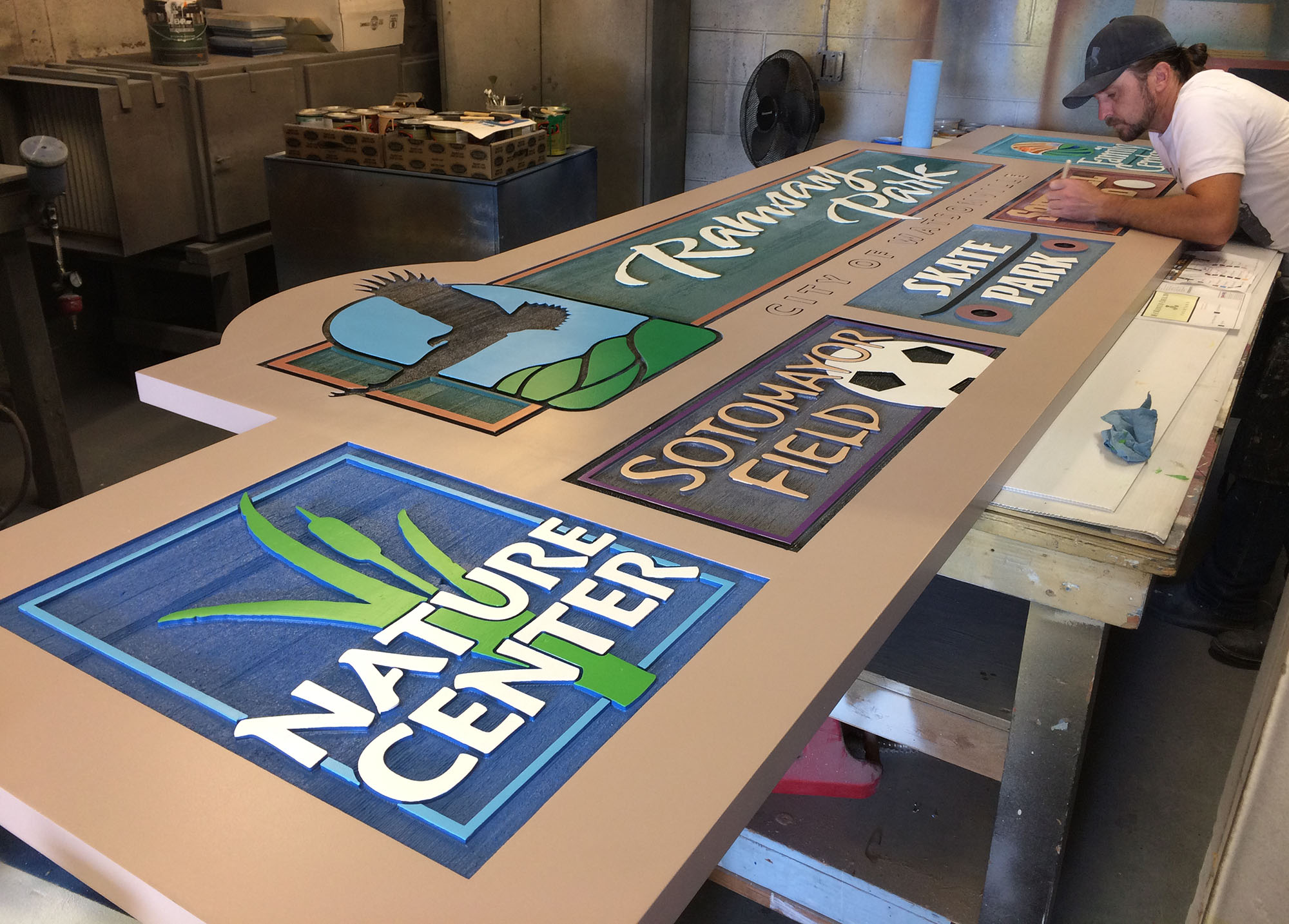 Ramsay Park sign being hand-painted in the Signworks shop