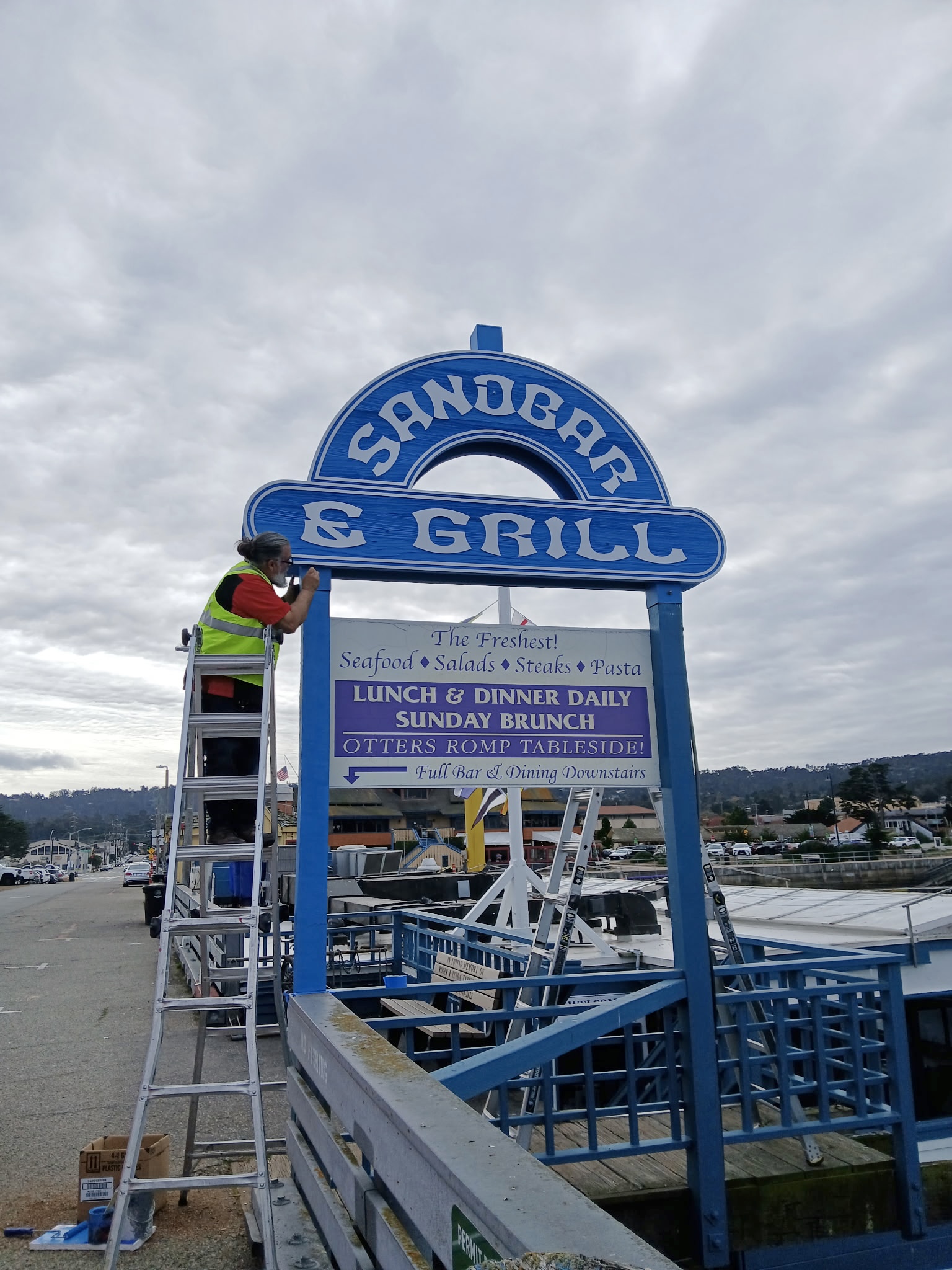 New Sandbar & Grill sandblasted sign installed at Monterey marina by Signworks